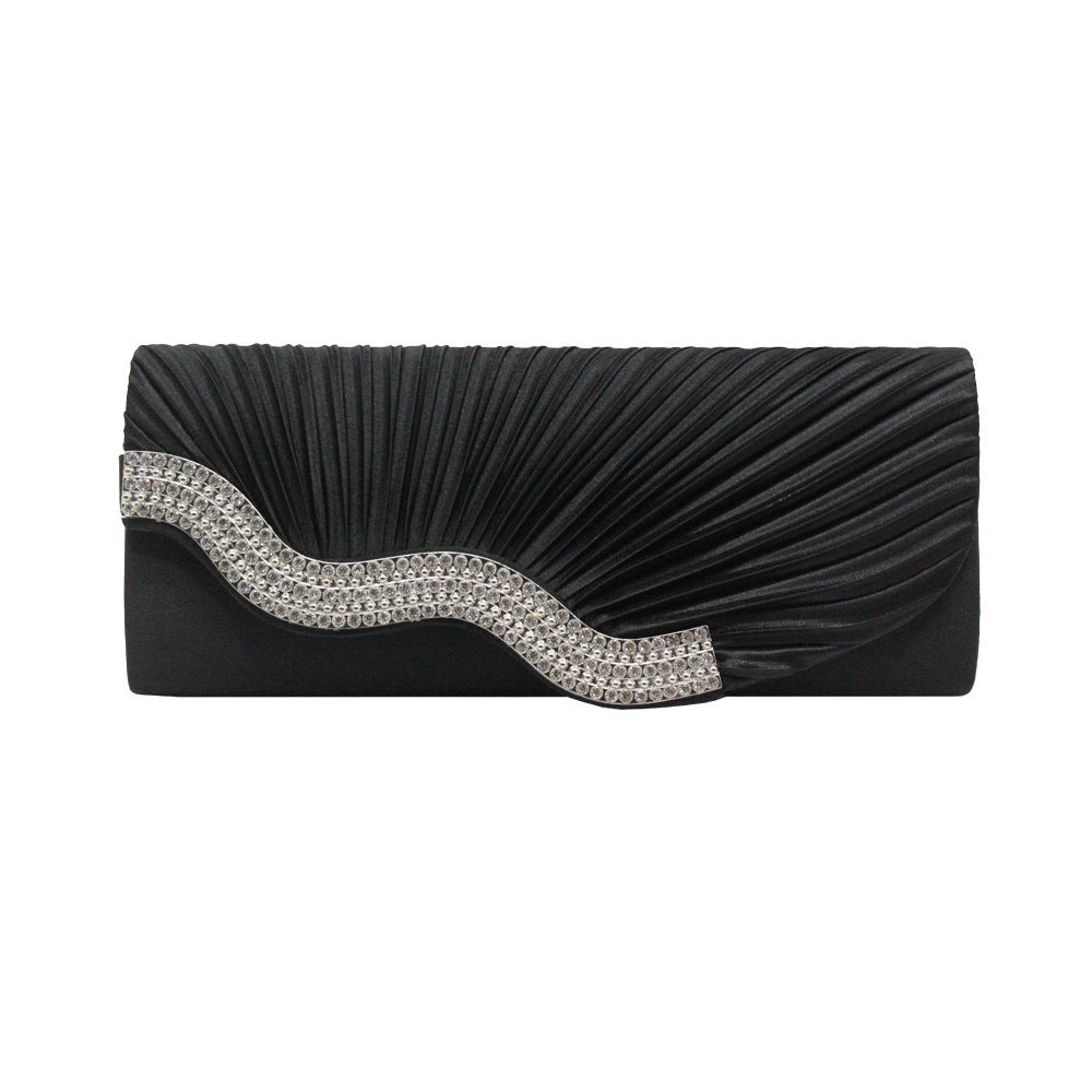 Black pleated clutch with silver rhinestone wave detail