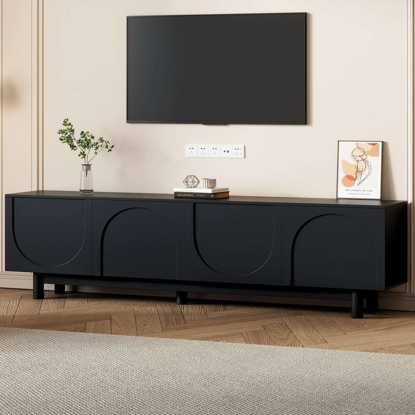 Black TV stand with centered media shelf area and arched front doors