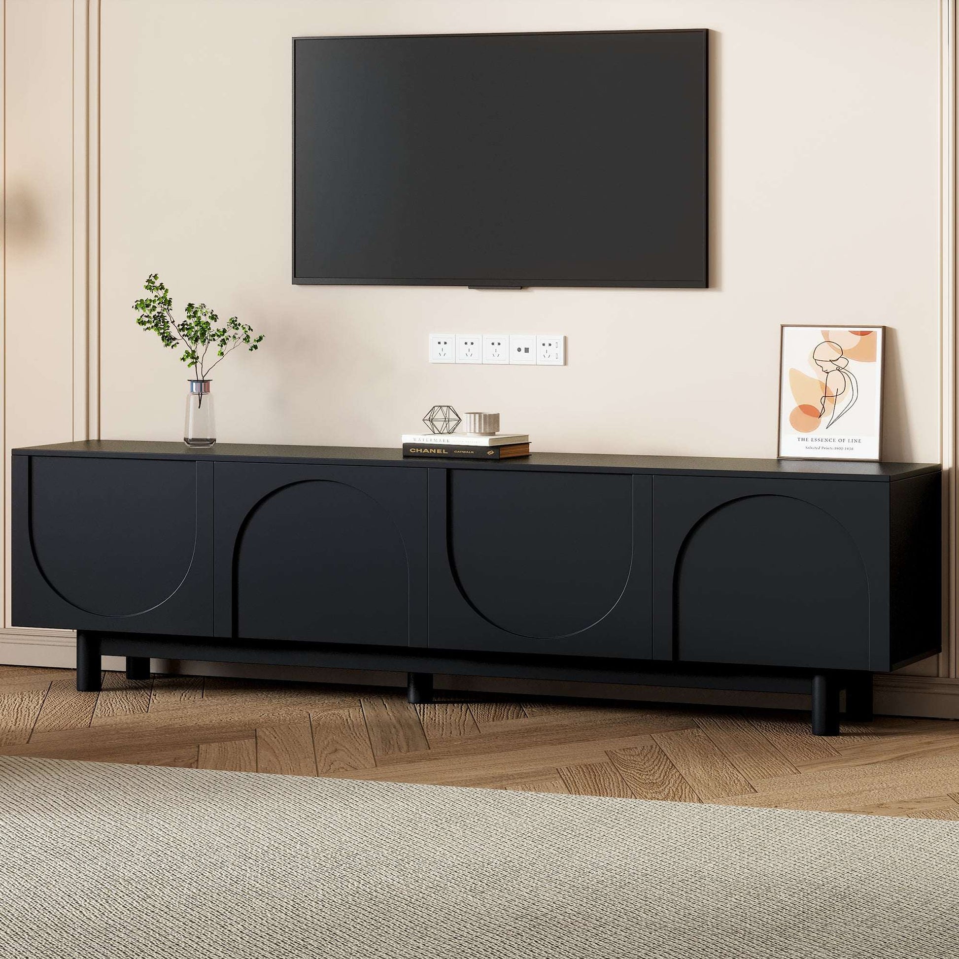 Black TV stand with centered media shelf area and arched front doors