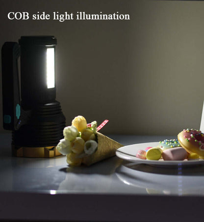Black rechargeable LED flashlight emitting bright white light from the COB front