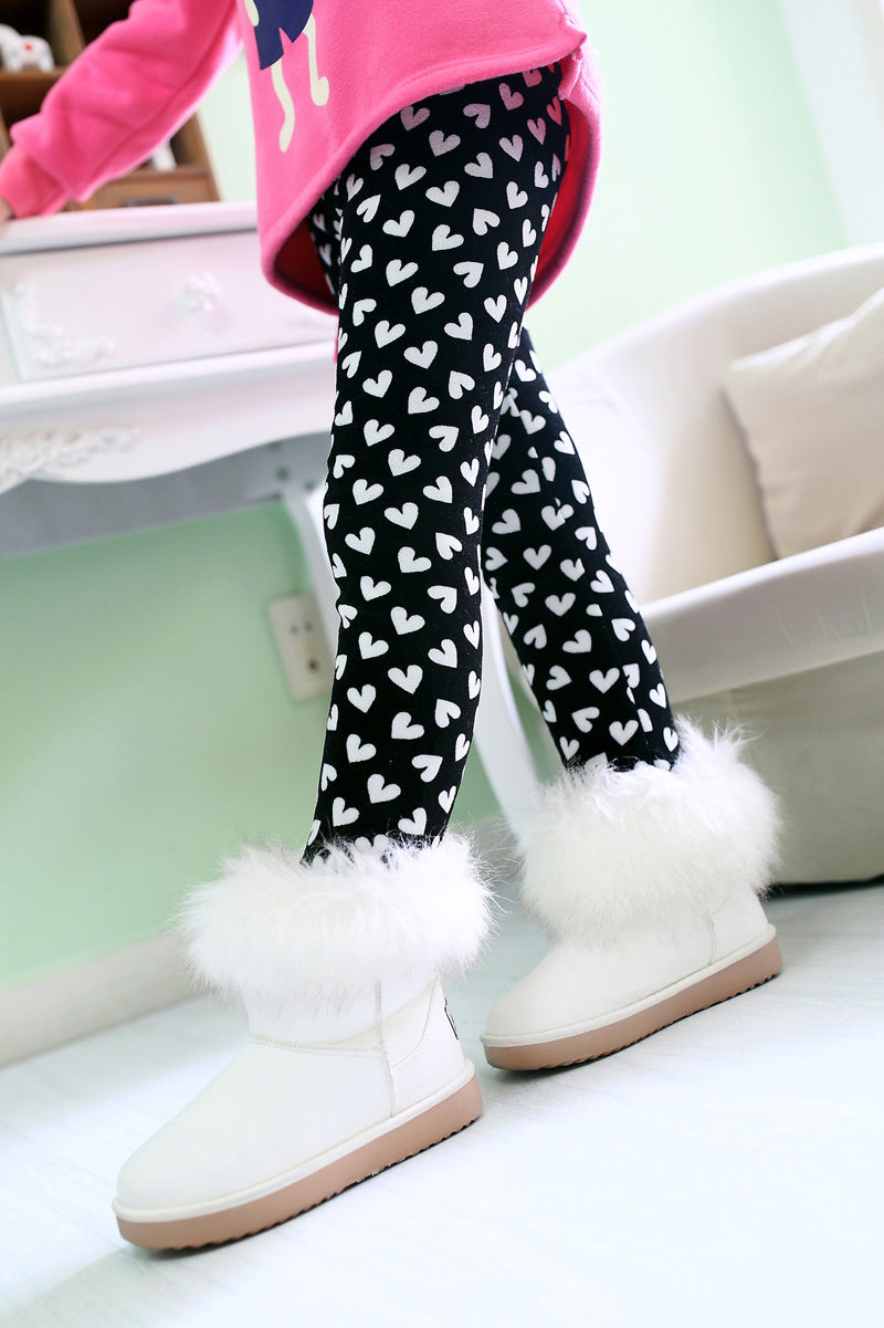 Girls' warm leggings in black with white heart print and fuzzy trim cuffs