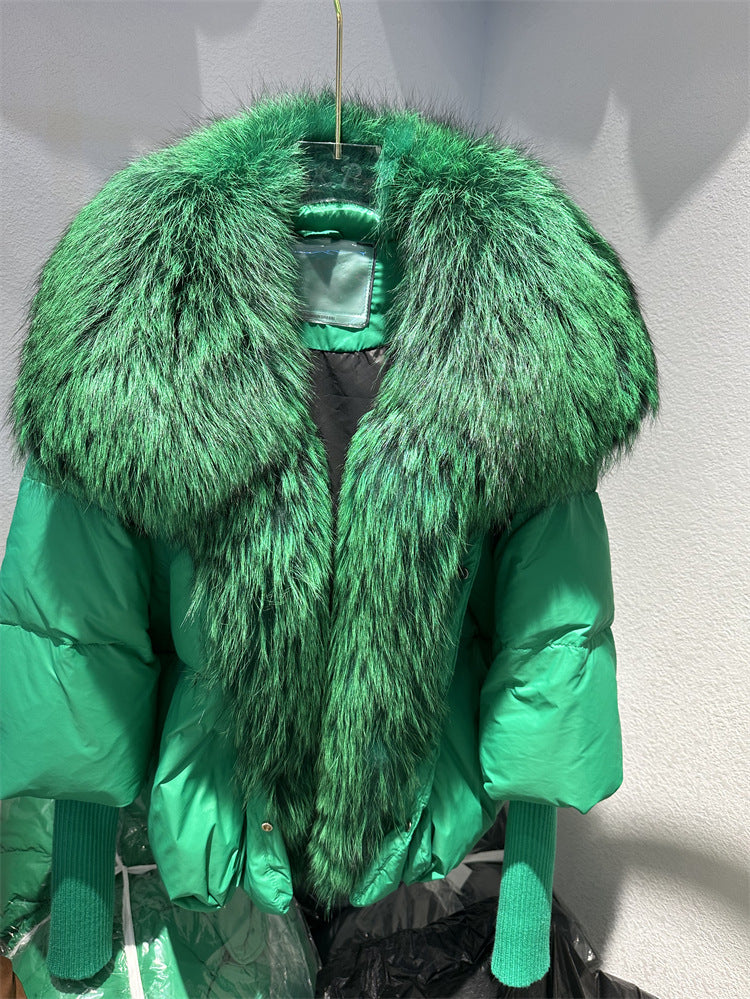 Green puffer jacket with large fur collar on a white background