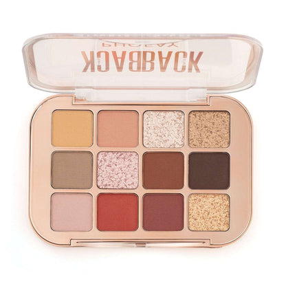 Makeup palette with various shades of eyeshadows on a white background