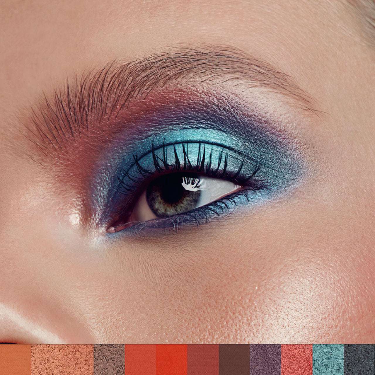 Close-up of a woman's eye with colorful makeup, including blue and purple shades.