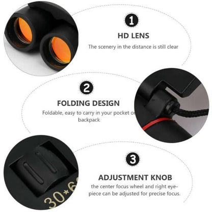 Black binoculars with orange lenses, folding design and adjustment knob close-up