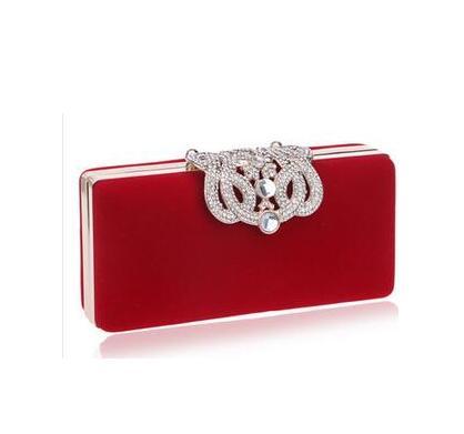 Rectangular red evening clutch with rhinestone ornate clasp and faux pearl