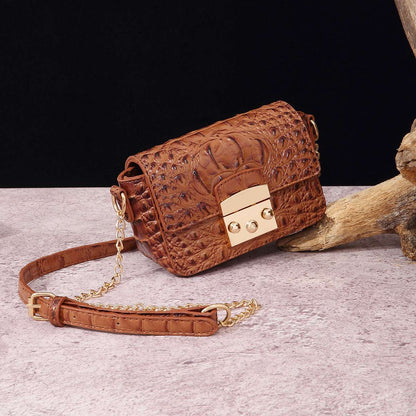 Tan/brown croc-textured one-shoulder crossbody bag with flap and gold-tone lock