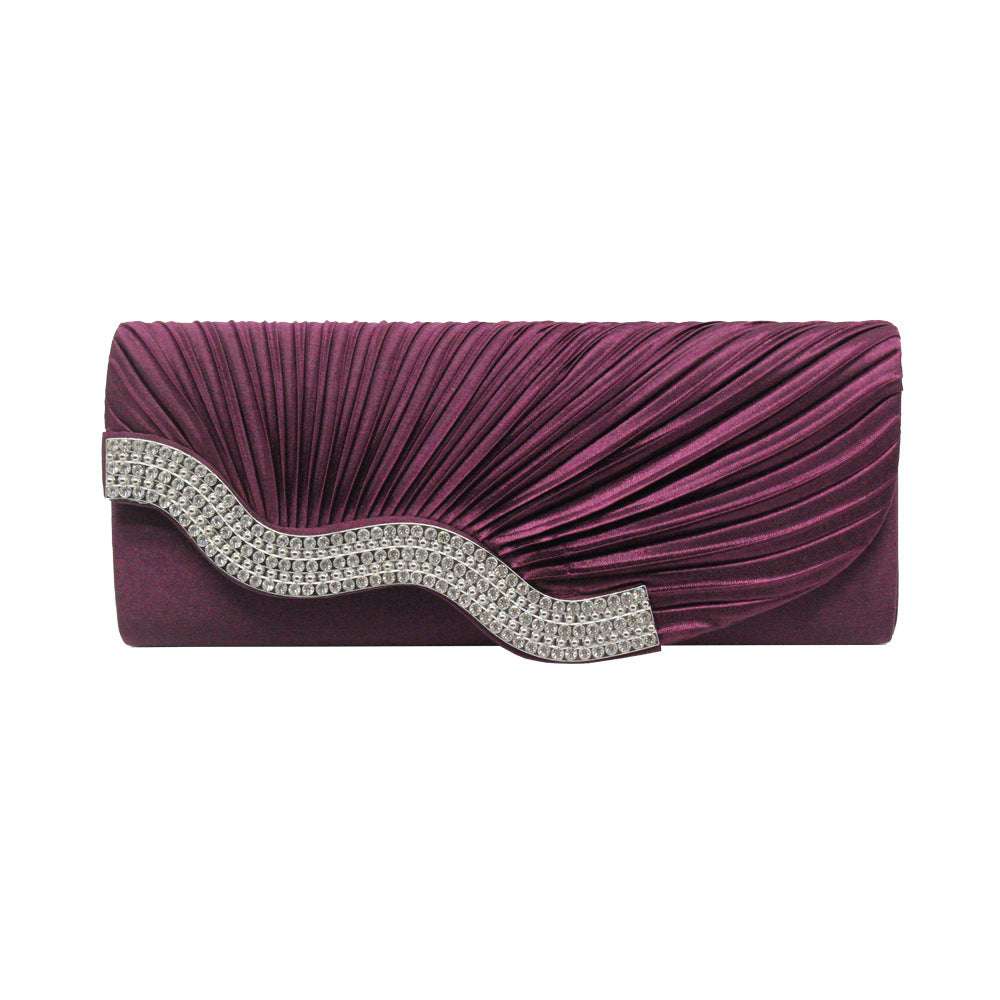 Wine red pleated clutch with silver rhinestone wave detail and flap closure