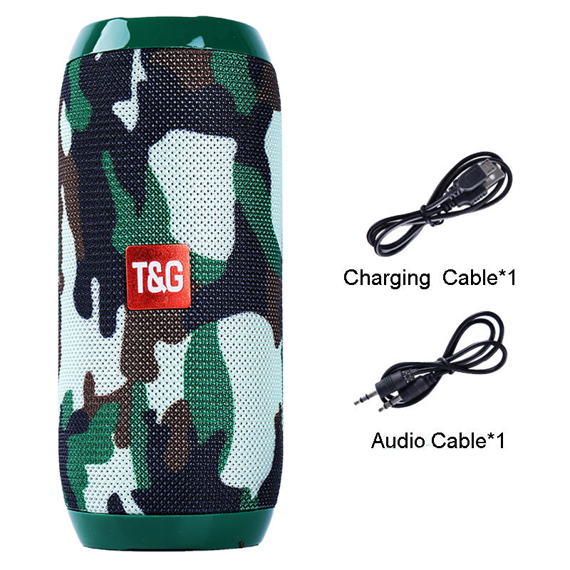 Bluetooth speaker, green camo mesh cylinder with T&G logo, shown with charging and audio cables.