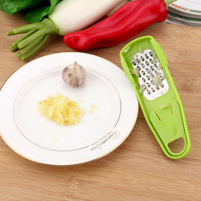 Light green manual garlic masher with grater holes and open U-shaped handle end