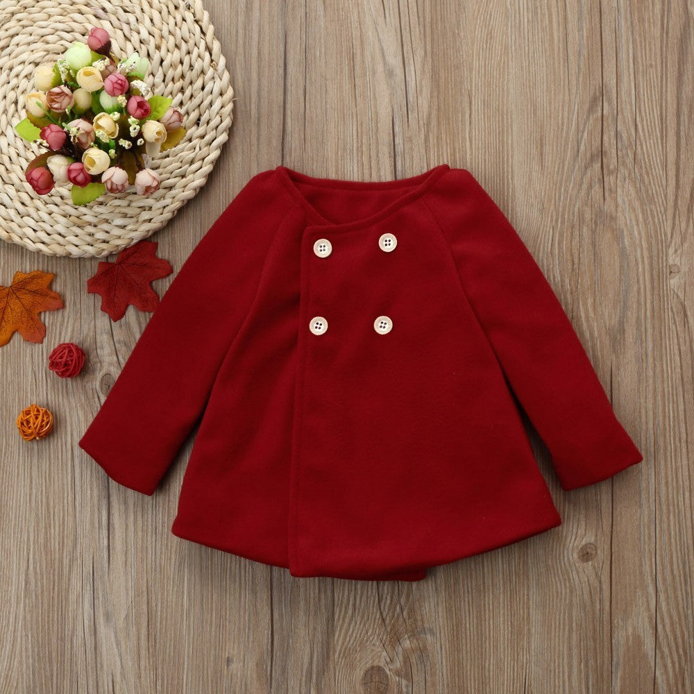 Kids trench coat in deep red with double-breasted button front and long sleeves