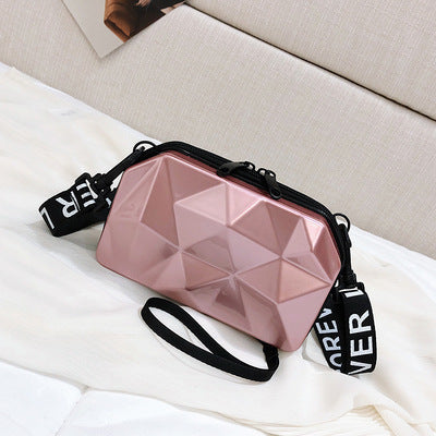 Blush pink geometric mini cosmetic bag with black zipper and wrist strap