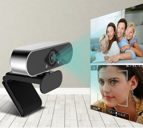 Webcam on a stand with a display of video calls and photos on a screen.