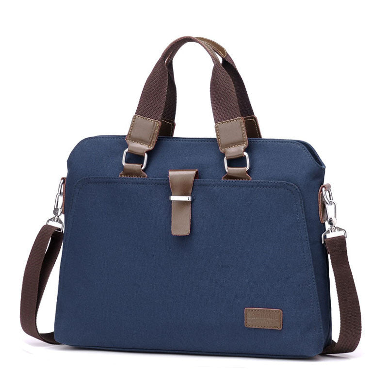 Canvas briefcase in blue with dual handles, shoulder strap, front metal clasp, and small patch