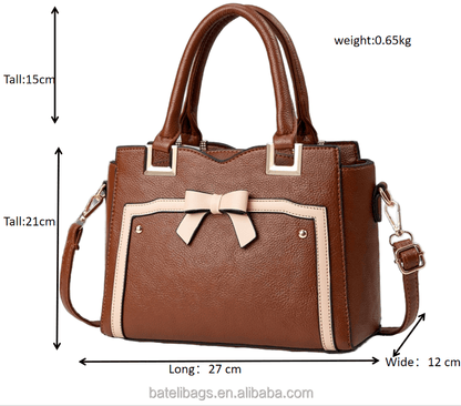 Brown commuting shoulder bag with cream stripe, bow front, and side crossbody strap