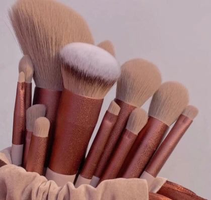 Makeup brush set with brown handles and white bristles, bundled fan view