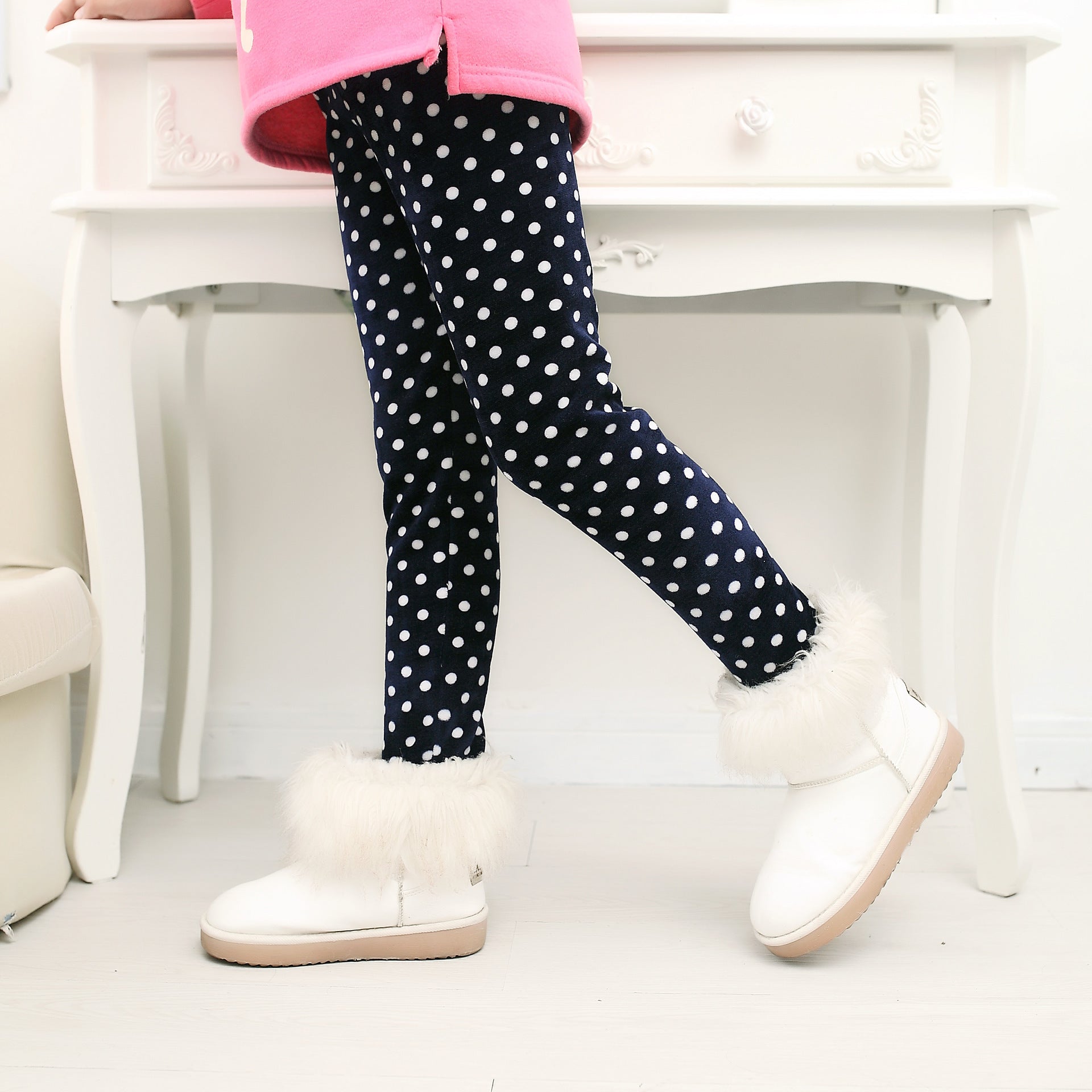 Girls' warm leggings in dark fabric with white polka dots and fuzzy trim cuffs