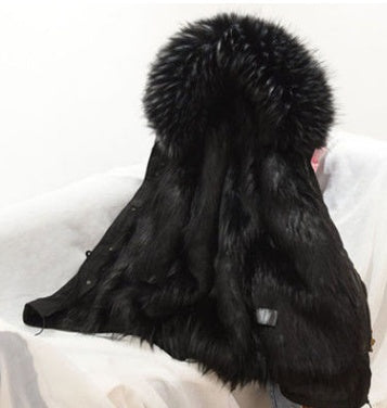 Black fur coat with a large fur pom-pom on a white background