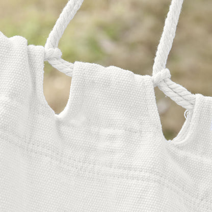 White macrame hammock with braided rope knots and open lattice fabric
