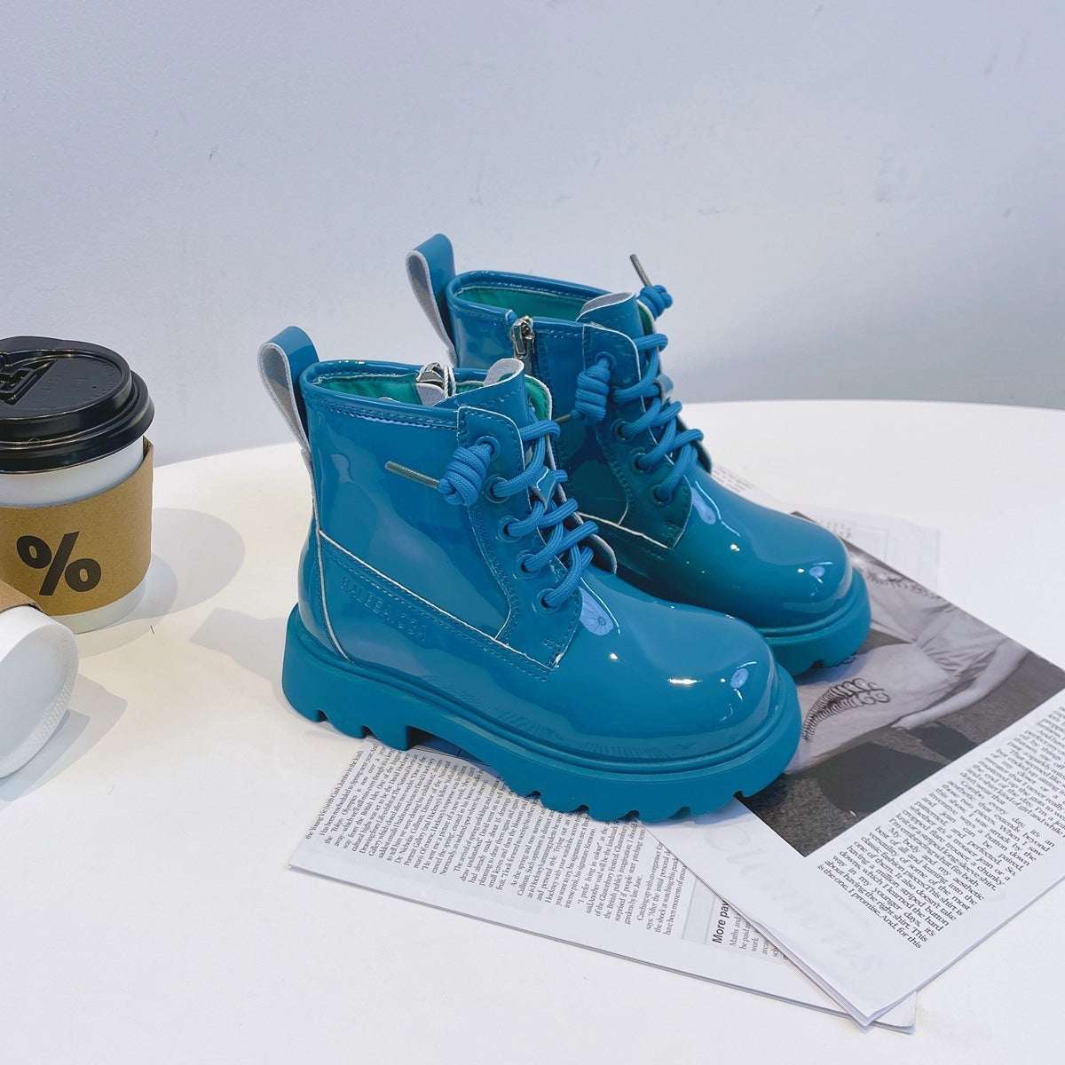 Lake blue glossy lace-up leather ankle boots with side panel, laces, and lug soles
