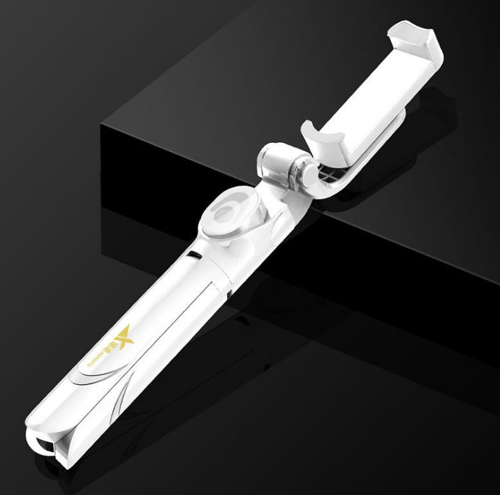 White selfie stick and tripod with phone clamp, angled view
