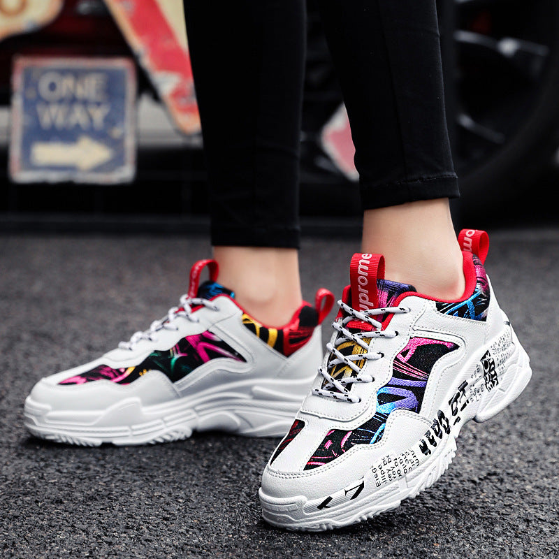 White running sneakers with red lace trims and bold multicolor side panels