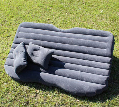 Dark gray ribbed inflatable car mattress with built-in pillow