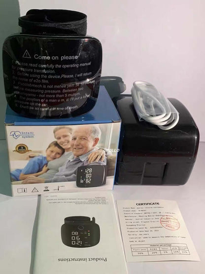 Wrist blood pressure monitor kit in box with documents and USB cable