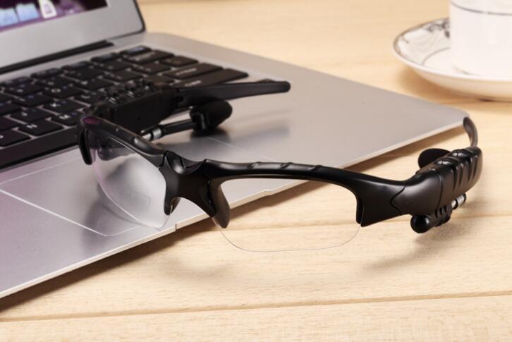 Black smart sunglasses with dark lenses and side microphone speaker