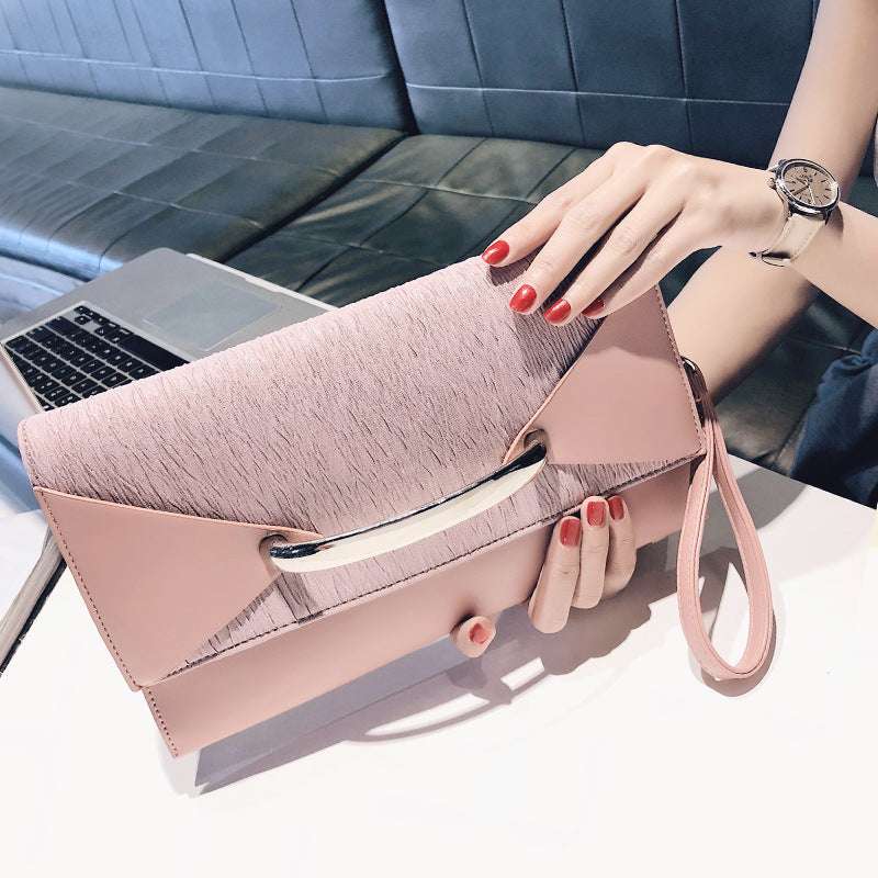 Pink textured clutch bag with metal-bar clasp and wrist strap