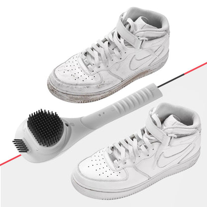 White sneakers with a cleaning tool on a white background