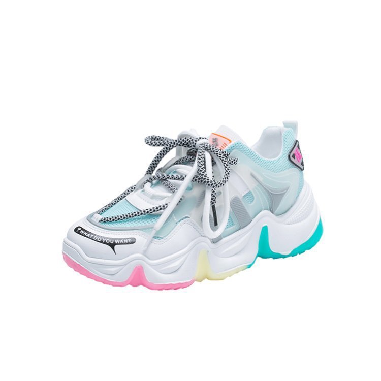 Light blue and white platform sneaker with teal heel detail, pink and yellow sole accents