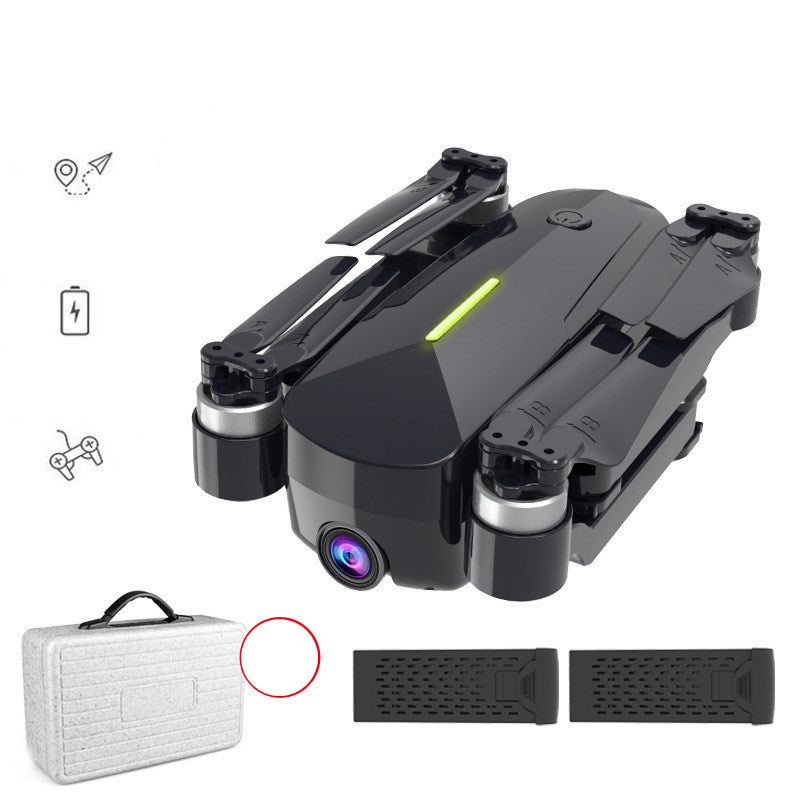 Black drone with front camera, plus carrying case and two dark textured accessory panels