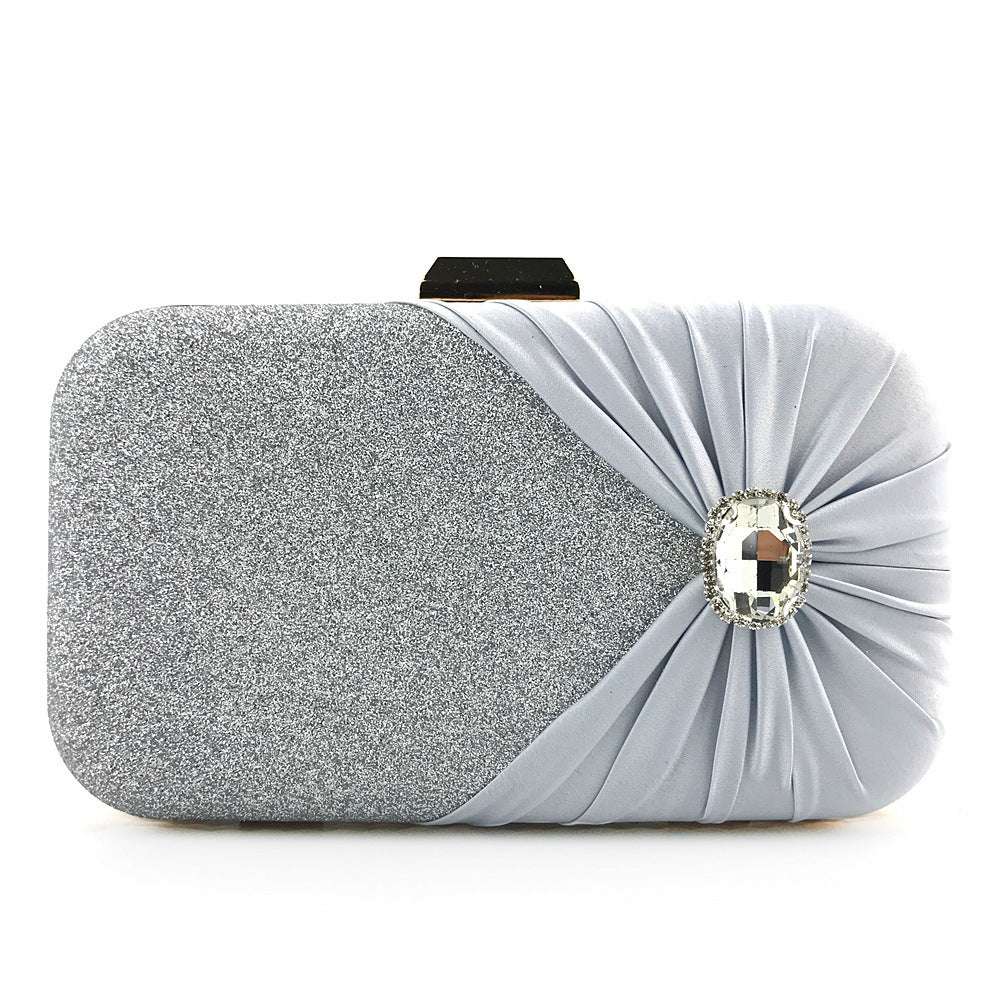 Silver glitter ladies clutch with ruched satin side and oval rhinestone gem clasp