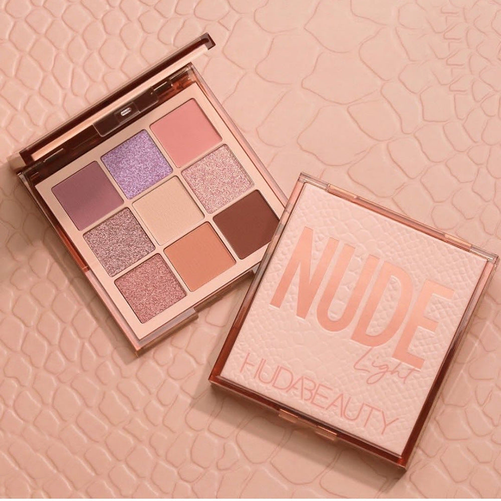 Nude eyeshadow palette with 9 pans in pink, mauve, lilac, and brown matte shades