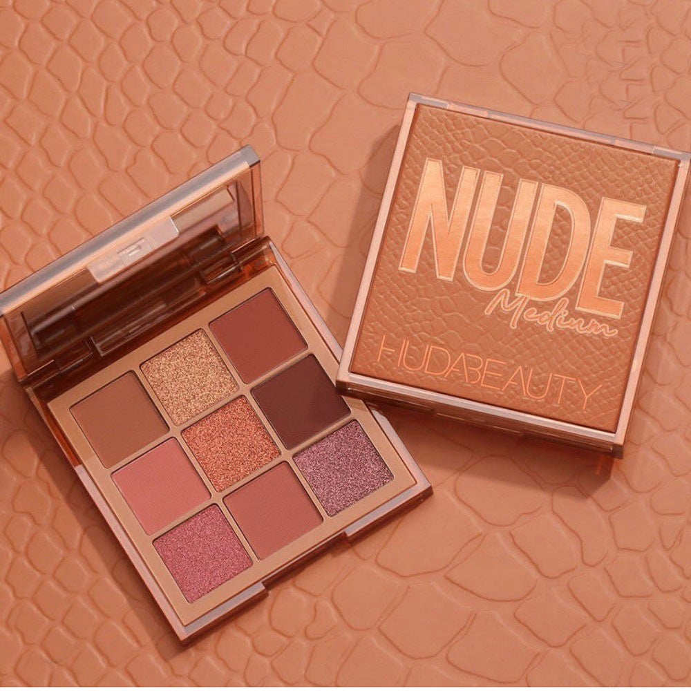 Nude eyeshadow palette with 9 pans in tan, rosy pink, and rose-gold shimmer shades