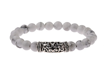 Gray beaded bracelet with ornate silver center clasp
