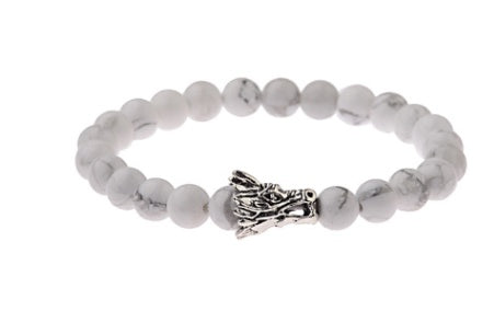 White beaded bracelet with silver dragon head charm