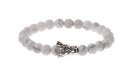 White beaded bracelet with silver dragon head charm