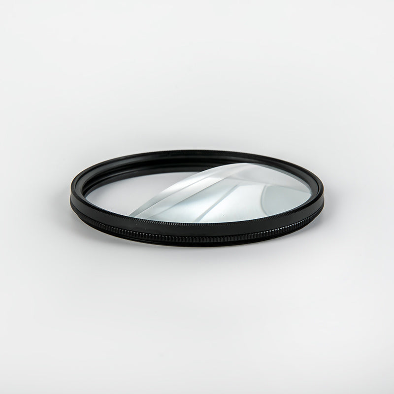 Camera lens filter with black rim on a white background