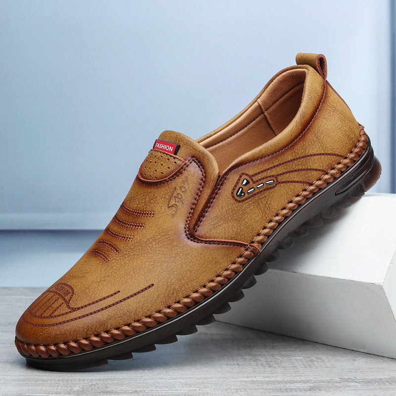 Men's casual slip-on sports shoe, tan-brown leather with moc toe stitching and thick tread sole