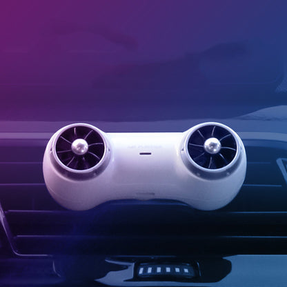 Car air freshener with dual fans on a car dashboard