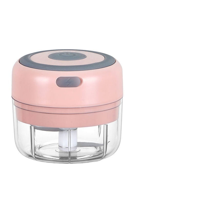 Electric garlic chopper with pink top and clear glass bowl, compact mini chopper