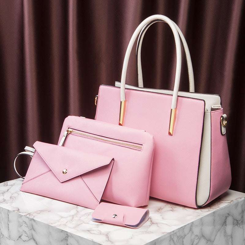 Large pink handbag set with matching envelope wallet and small wristlet pouch