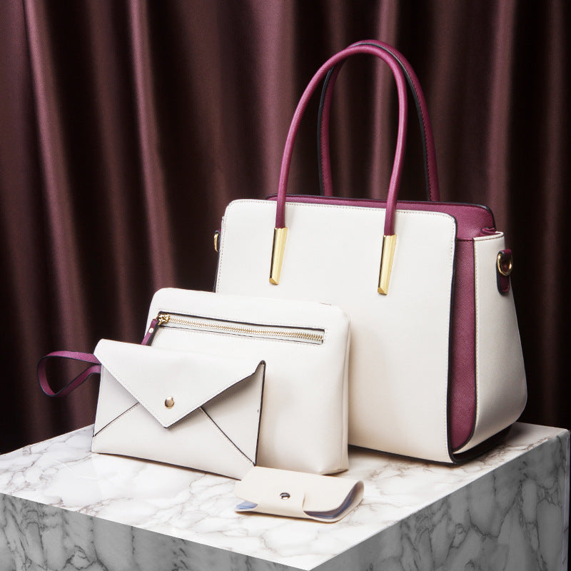 Large white handbag with magenta handles, envelope wallet and mini pouch