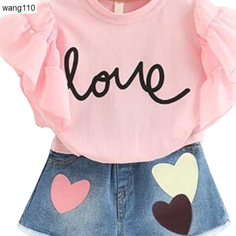 Girls' pink ruffle-sleeve T-shirt with 'love' print; denim skirt with hearts in pastel colors