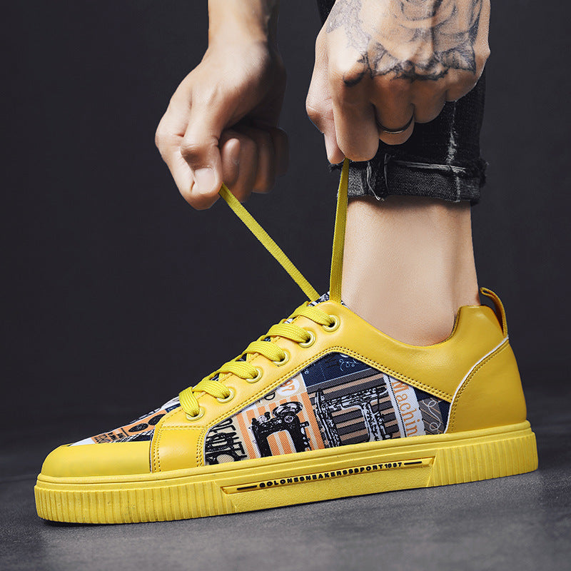 Graffiti canvas sneakers, yellow upper with navy collage side, matching yellow sole