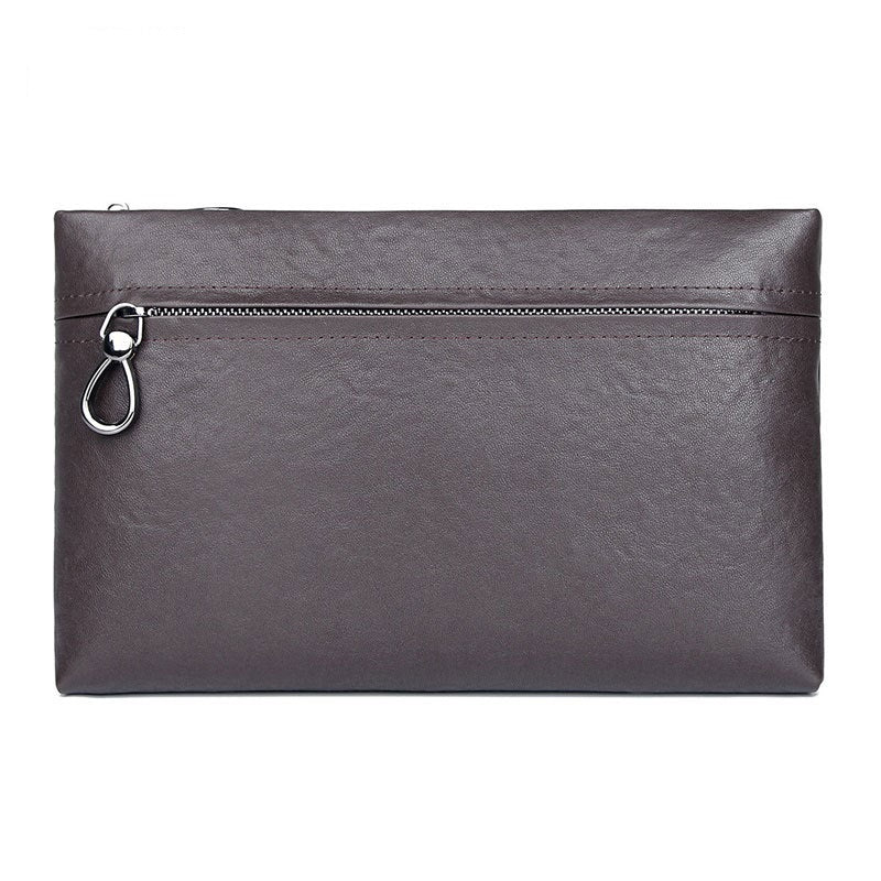 Dark brown large clutch bag with top zipper and metal ring pull, smooth leather-look