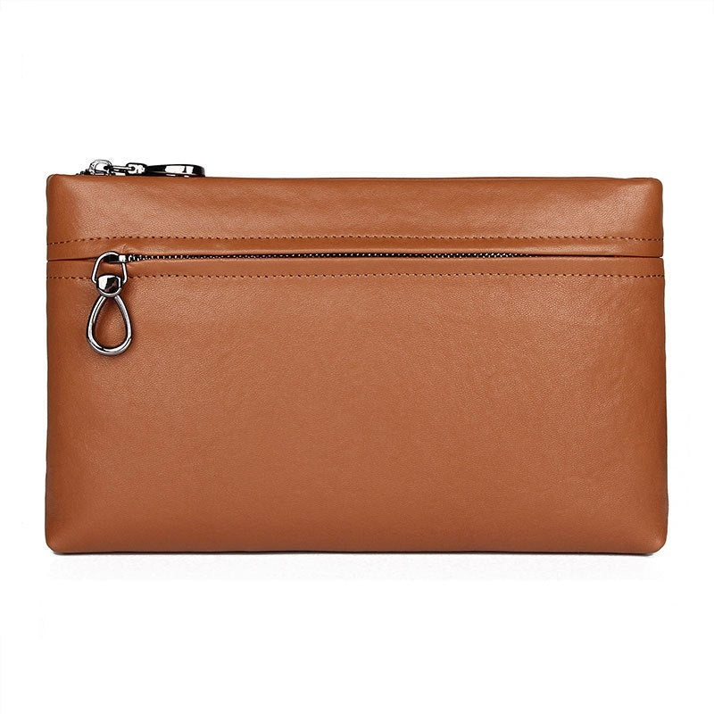 Brown large clutch bag with top zipper and metal ring pull, rectangular silhouette