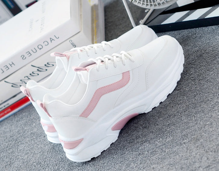 Women's casual sneakers in white with pink side stripe, padded heel, lace-up